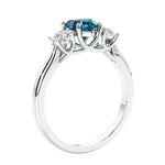 3 stone diamond engagement ring with Heart shaped center in white gold.