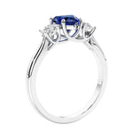 3 stone diamond engagement ring with Heart shaped center in white gold.