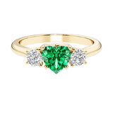 Heart shaped 3 stone engagement ring with elegant diamond side stones.