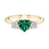 Heart shaped 3 stone engagement ring with elegant diamond side stones.