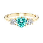 Heart shaped 3 stone engagement ring with elegant diamond side stones.