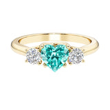 Heart shaped 3 stone engagement ring with elegant diamond side stones.