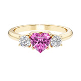 Heart shaped 3 stone engagement ring with elegant diamond side stones.