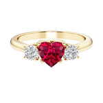 Heart shaped 3 stone engagement ring with elegant diamond side stones.
