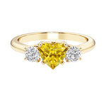 Heart shaped 3 stone engagement ring with elegant diamond side stones.
