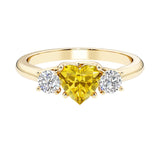 Heart shaped 3 stone engagement ring with elegant diamond side stones.