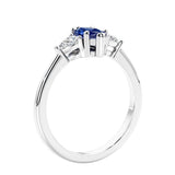 Marquise shaped engagement ring with diamonds in classic 3 stone ring setting.