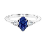 Three stone marquise diamond ring with dramatic center shape.