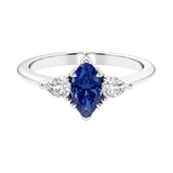 Three stone marquise diamond ring with dramatic center shape.