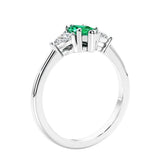 Marquise shaped engagement ring with diamonds in classic 3 stone ring setting.