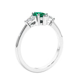 Marquise shaped engagement ring with diamonds in classic 3 stone ring setting.