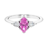 Three stone marquise diamond ring with dramatic center shape.