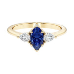 Marquise cut 3 stone engagement ring with elegant taper.