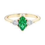 Marquise cut 3 stone engagement ring with elegant taper.