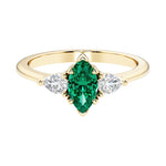 Marquise cut 3 stone engagement ring with elegant taper.