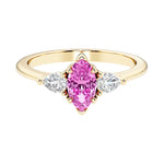 Marquise cut 3 stone engagement ring with elegant taper.
