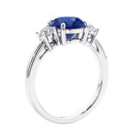 3 stone wedding ring featuring round center diamond and matching sides.