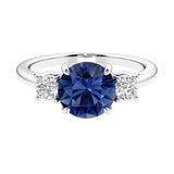 Timeless three stone round diamond engagement ring.