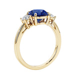 3 stone round diamond ring in classic yellow gold setting.