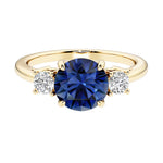 Three stone round engagement ring with brilliant cut diamonds.