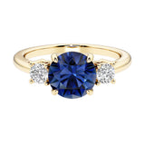 Three stone round engagement ring with brilliant cut diamonds.