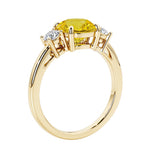 3 stone round diamond ring in classic yellow gold setting.