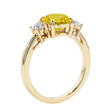 3 stone round diamond ring in classic yellow gold setting.