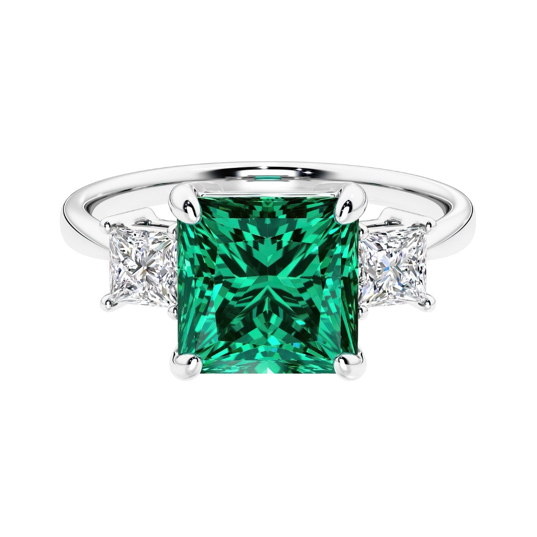 3 stone princess diamond ring in sleek white gold with green emerald gemstone center.