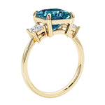Elegant three stone princess cut engagement ring with alexandrite and diamonds.