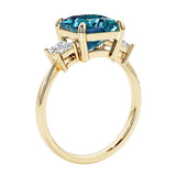 Elegant three stone princess cut engagement ring with alexandrite and diamonds.
