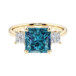 Princess cut 3 stone engagement ring with square side diamonds and alexandrite gemstone center.