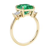 Elegant three stone princess cut engagement ring with colombian emerald and diamonds.