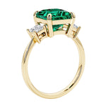 Elegant three stone princess cut engagement ring with green emerald and diamonds.