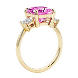 Elegant three stone princess cut engagement ring with pink sapphire and diamonds.