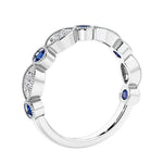 Half eternity gemstone and diamond ring with 9 marquise stones—perfect for a wedding anniversary.
