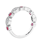 Half eternity gemstone and diamond ring with 9 marquise stones—perfect for a wedding anniversary.