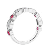 Half eternity gemstone and diamond ring with 9 marquise stones—perfect for a wedding anniversary.
