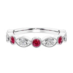 Elegant vintage-inspired anniversary ring featuring marquise ruby and diamonds in a 9 stone setting.