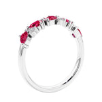 Women’s anniversary ring with lab created ruby and sparkling round diamonds in a vintage-inspired half eternity style.