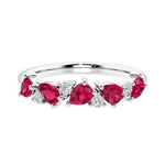 Elegant anniversary ring with 9 alternating pear shaped ruby and brilliant round diamonds.