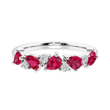 Elegant anniversary ring with 9 alternating pear shaped ruby and brilliant round diamonds.