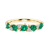 9-stone gemstone anniversary band featuring pear-cut green emeralds and round diamonds for a magical, color-shifting effect.