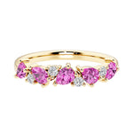9-stone gemstone anniversary band featuring pear-cut pink sapphires and round diamonds for a magical, color-shifting effect.