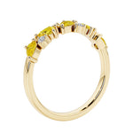 Unique 9 stone half eternity ring with pear shaped yellow sapphire and round diamond accents in yellow gold.