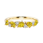 9-stone gemstone anniversary band featuring pear-cut yellow sapphires and round diamonds for a magical, color-shifting effect.