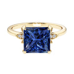 Nature inspired ring featuring princess cut blue sapphires and round diamonds for a magical, color-shifting effect.
