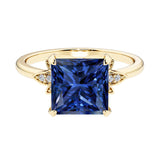 Nature inspired ring featuring princess cut blue sapphires and round diamonds for a magical, color-shifting effect.
