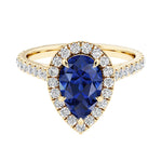 Pear shaped blue sapphire and french pave diamond ring.