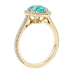Beautiful Paraiba Tourmaline french pave diamond engagement ring with classic styling.
