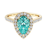 Pear shaped paraiba tourmaline and french pave diamond ring.
